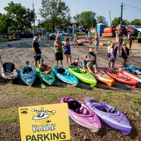 a group of people sitting at a beach