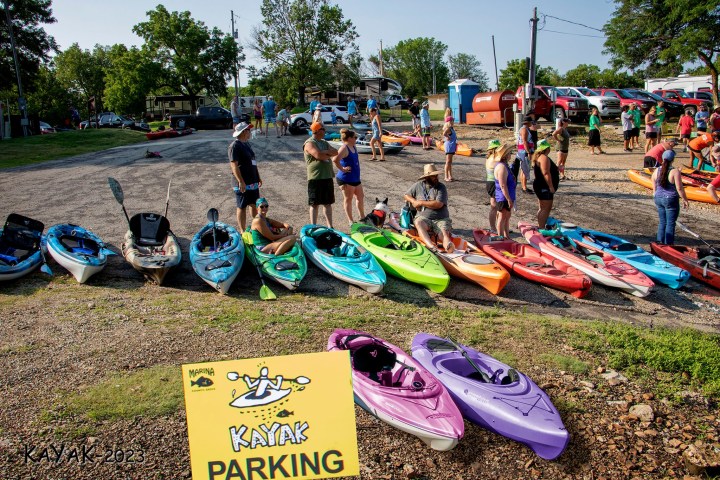 a group of people sitting at a beach
