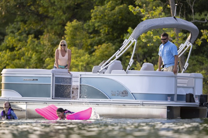 a group of people riding on the back of a boat