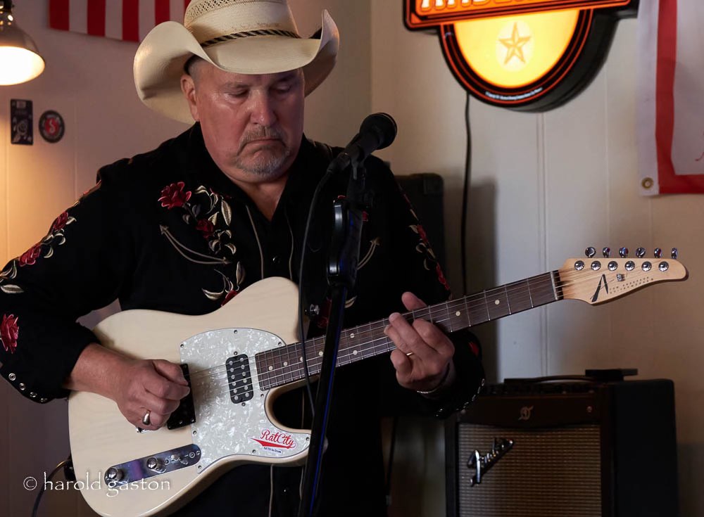 a man holding a guitar